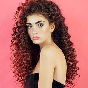 Woman with long frizzy and curly hair