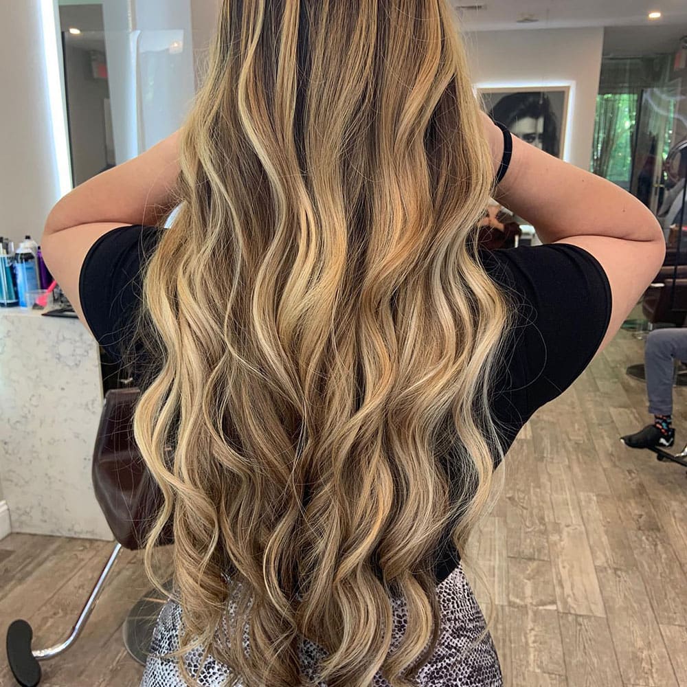 happy client from white plains at numi hair salon in scarsdale