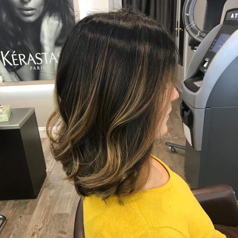 woman with short haircut after commuting from pleasantville to numi hair salon in scarsdale