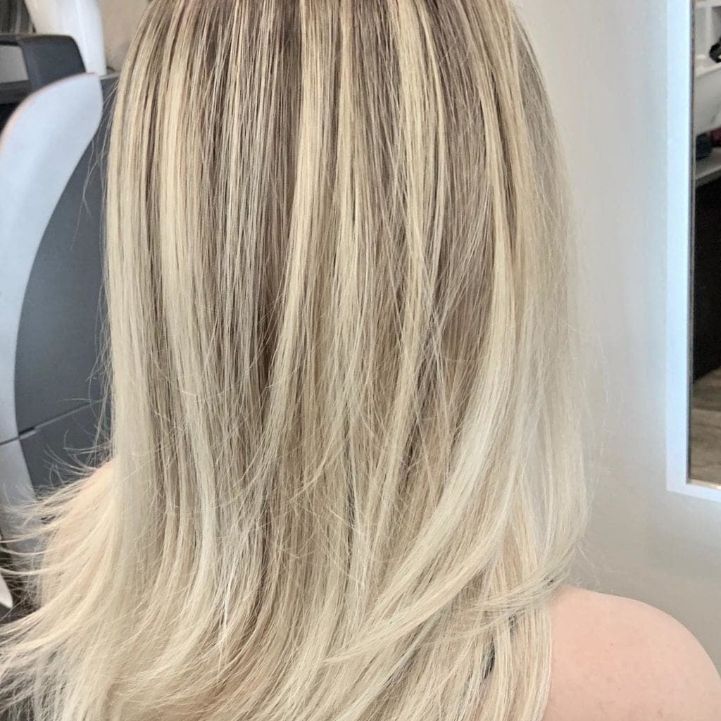 Smooth, shiny keratin-treated curly hair at Numi Hair Salon