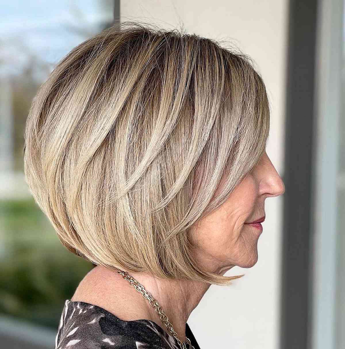 woman with short haircut after commuting from tarrytown to numi hair salon in scarsdale