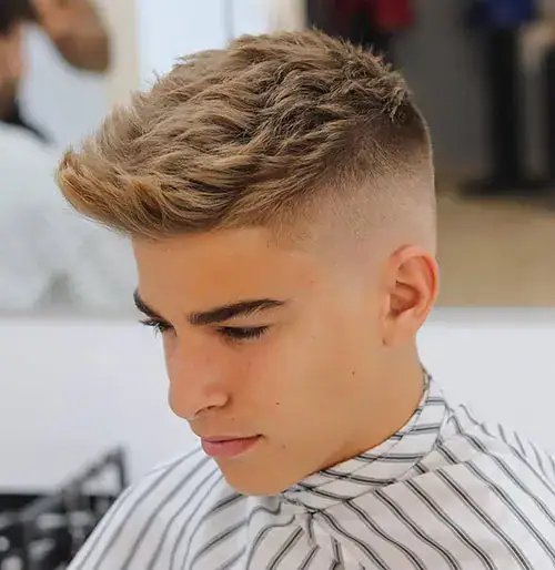 Textured crop haircut, a clean grow-out stage from a buzz cut