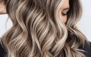 Foil highlights on blonde hair creating uniform brightness at Numi Hair Salon Westchester