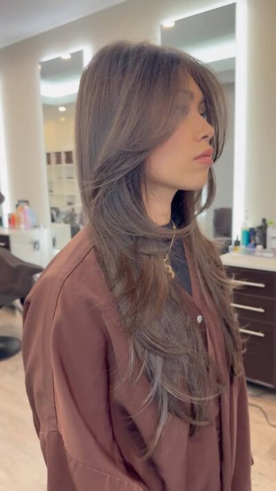 Face-framing textured layers cut at a hair salon serving White Plains, NY