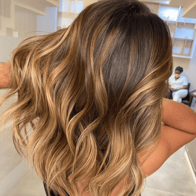 Sun-kissed balayage with hand-painted blending, trending in White Plains, NY