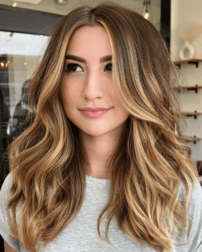 Warm blonde hair with caramel highlights, a top color trend in White Plains, NY