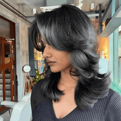 Wolf cut with choppy layers and volume at the crown, trending in White Plains, NY