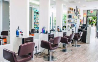 Interior of Numi Hair Salon in Scarsdale NY with styling chairs and mirrors