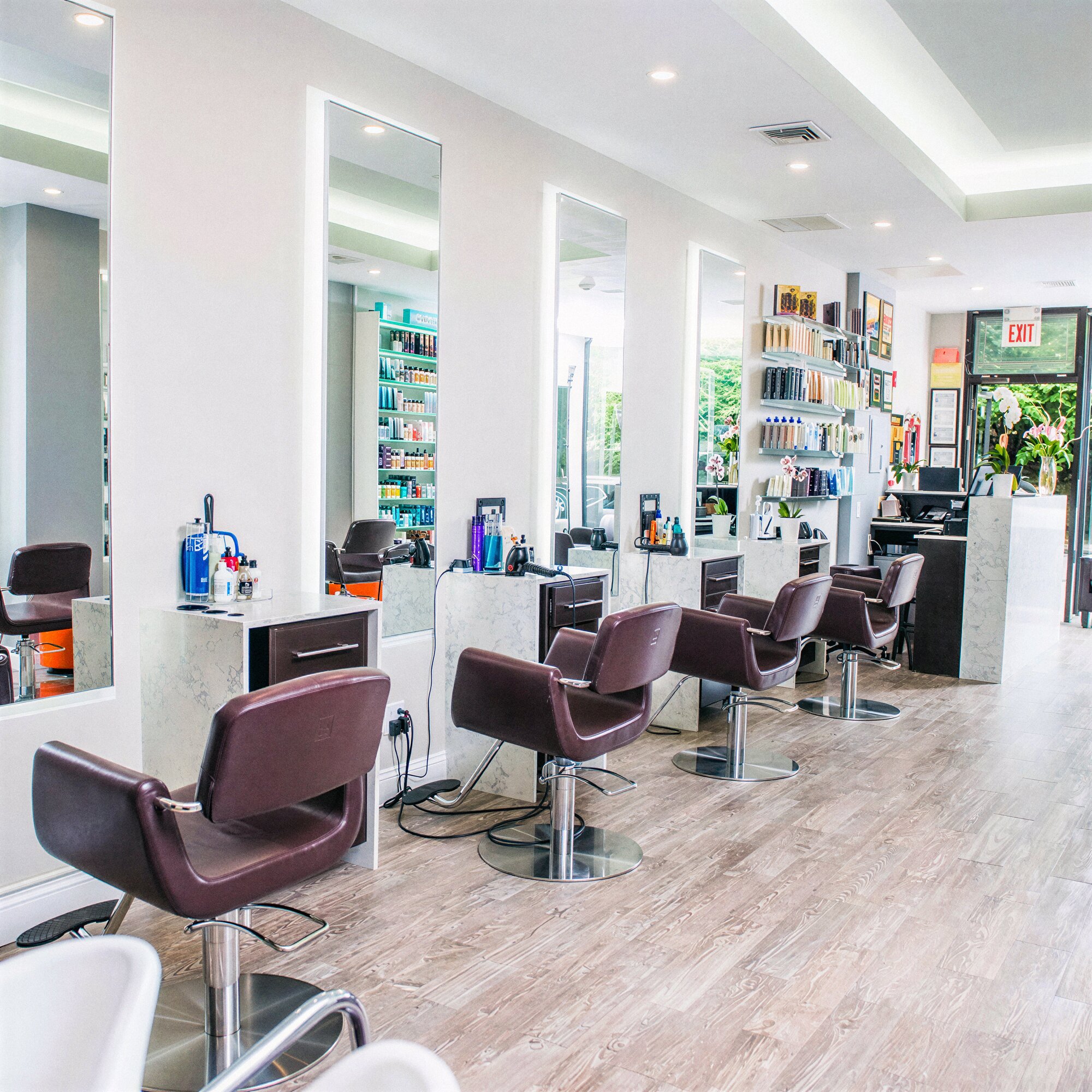Interior of Numi Hair Salon in Scarsdale NY with styling chairs and mirrors