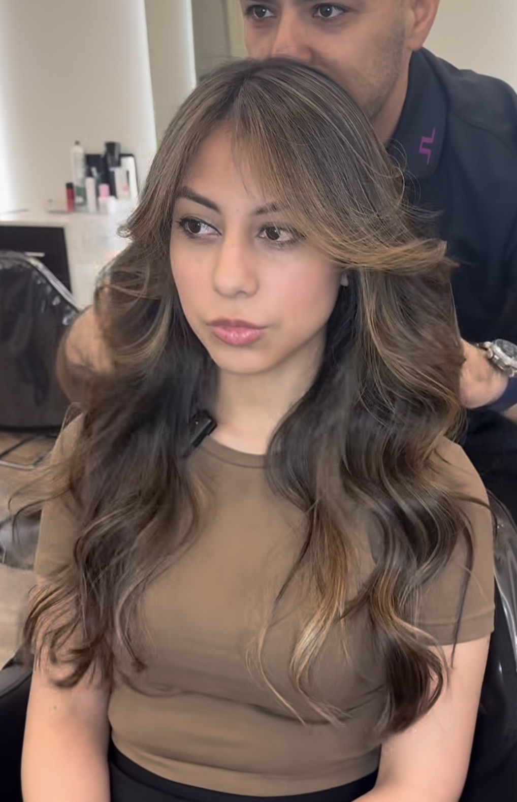 happy woman from pound ridge with gabriel at numi hair salon in scarsdale
