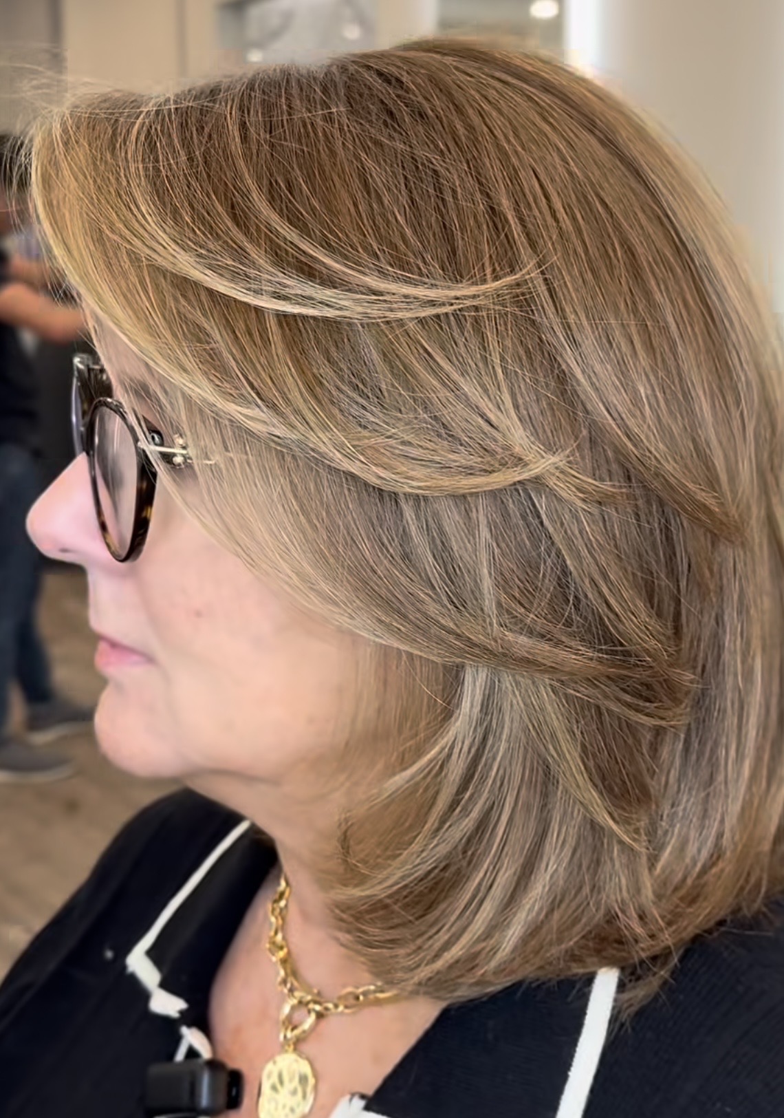 woman with short haircut after commuting from north castle ny to numi hair salon in scarsdale