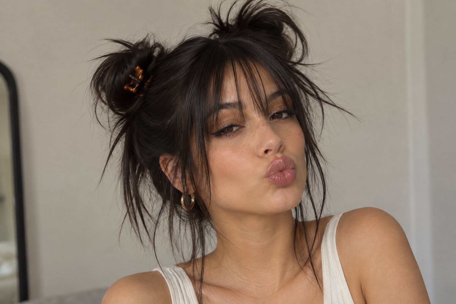 Y2K inspired hair with a center part and face framing pieces, a 2027 hair trend at Numi Hair Salon in Scarsdale NY