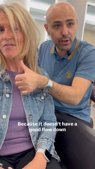 Stylist with client explaining a cut, text overlay